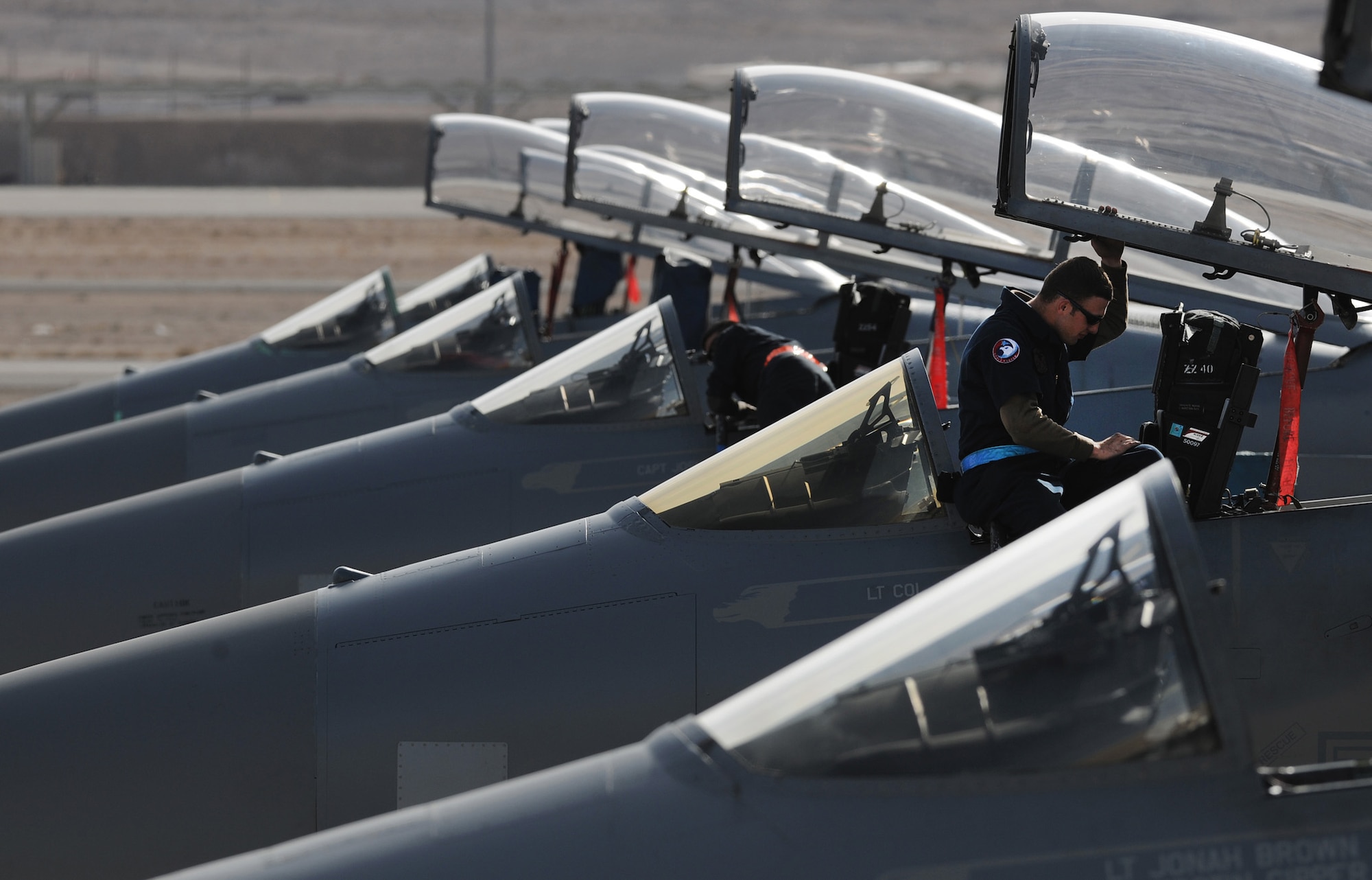 NELLIS AIR FORCE BASE, Nev. -- Senior Airman Samuel Frey a crew chief assigned the 18th Aircraft Maintenance Squadron, deployed in support of Red Flag 10-2 at Nellis Air Force Base, Nev., performs a pre-flight inspection on a 44th Fighter Squadron F-15 cockpit Feb. 2, 2010.  Red Flag is a realistic combat training exercise involving the air forces of the United States and its allies. The exercise is conducted on the 15,000-square-mile Nevada Test and Training Range, north of Las Vegas. (U.S. Air Force photo by Tech. Sgt. Michael R. Holzworth/RELEASED)