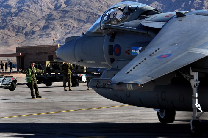 NELLIS AIR FORCE BASE, Nev. -- Senior Aircraftman Malcolm, assigned to Royal Air Force Cottesmore, United Kingdom, directs a GR-9 Harrier to taxi out at Red Flag 10-2, Feb. 1, 2010. (U.S. Air Force photo by Airman 1st Class Brett Clashman/RELEASED)