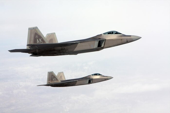NELLIS AIR FORCE BASE, Nev.-- Two F-22 Raptors from Elmendorf Air Force Base, Alaska, reform after being refueled during Red Flag 10-2.  Red Flag is a realistic combat training exercise involving the air forces of the United States and its allies. The exercise is conducted on the 15,000-square-mile Nevada Test and Training Range, north of Las Vegas.(U.S. Air Force photo by Tech. Sgt. Bucky Parrish)