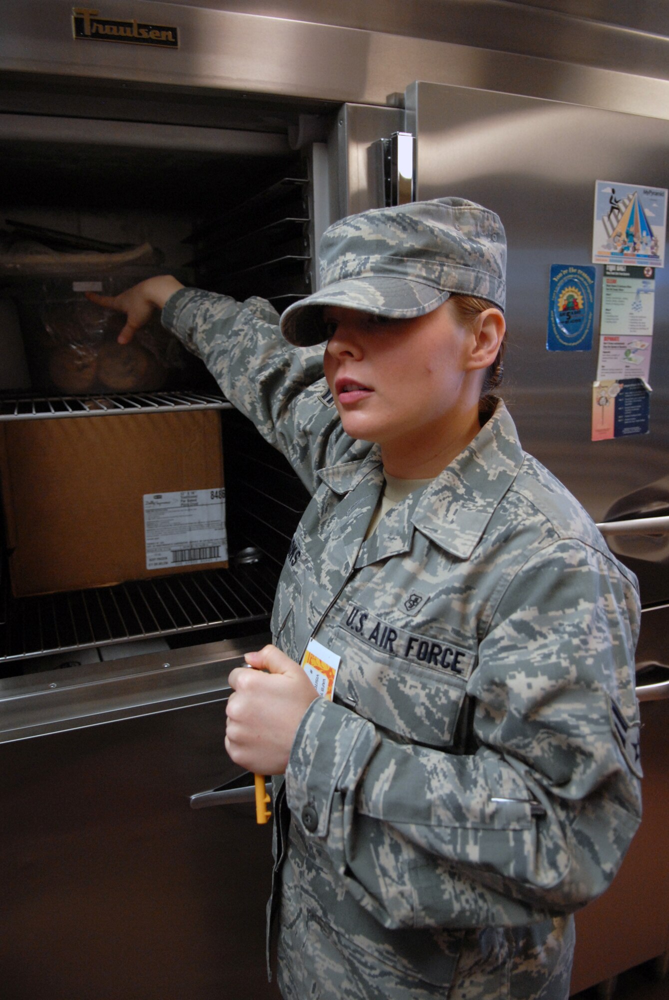 VANDENBERG AIR FORCE BASE, Calif. -- Verifying the necessary temperature of the refrigerators, Airman 1st Class Brooke Parks of the 30th Medical Operations Squadron Public Health office proceeds with a surprise inspection here Tuesday, Feb. 2, 2010. These types of inspections are conducted to not only check the cleanliness of the facilities, but also the way in which food items are stored and the security of the food deliveries made to the base. (U.S. Air Force photo/Airman 1st Class Angelina Drake)
