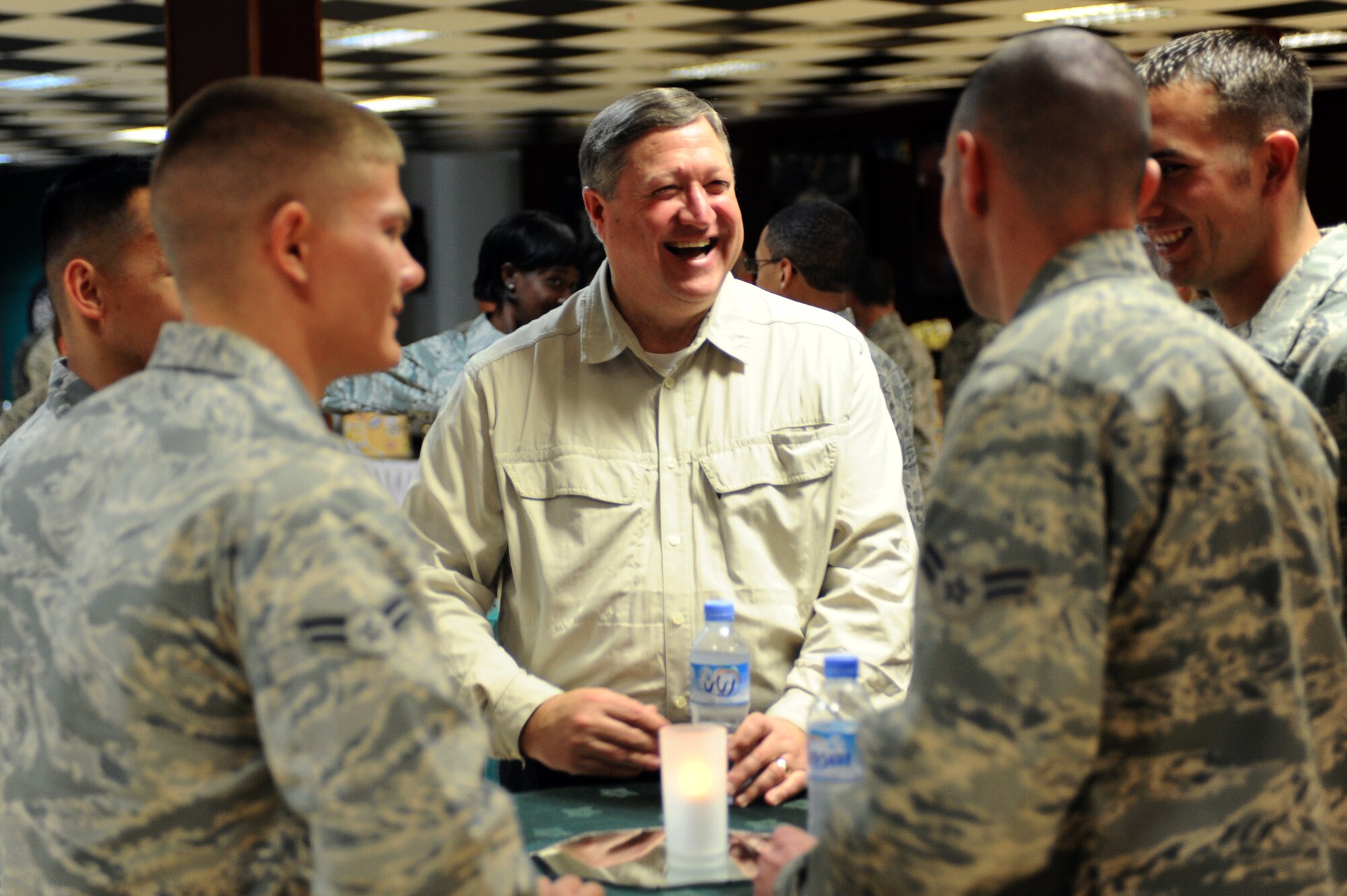 Secretary of the Air Force Michael Donley socializes with 379th Air Expeditionary Wing Airmen during his visit Jan. 29, 2010, to a deployed location in Southwest Asia. (U.S. Air Force photo/Senior Airman Kasey Zickmund)