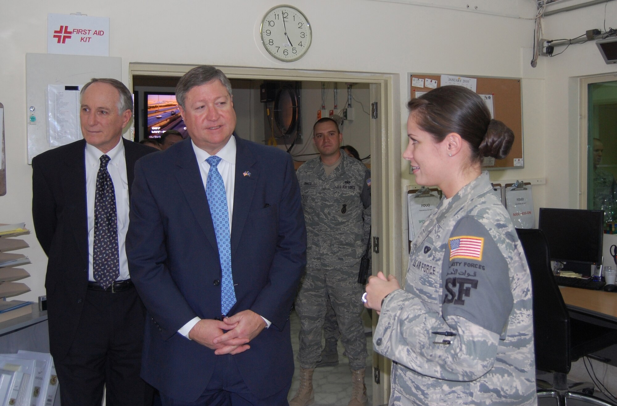 Staff Sgt. Jamie James briefs Secretary of the Air Force Michael Donley and Terry Marlow on the Base Defense Operations Center Jan. 30, 2010, at a deployed location in Southwest Asia. Sergeant James is from the 64th Expeditionary Security Forces Squadron. (U.S. Air Force photo/Staff Sgt. Kyle Ray)