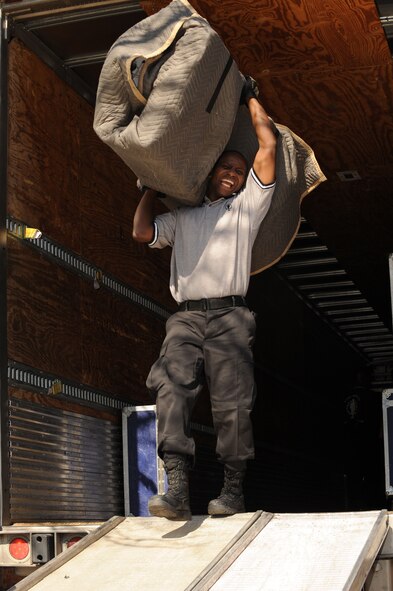 SUMTER, S.C. -- Tech. Sgt. Octavius Hill, a performer with Tops In Blue, unloads stage equipment before performing for the Sumter community at Patriot Hall, Feb. 3. Tops in Blue entertains servicemembers and their families, coalition partners and audiences around the globe with musical theatrics. Their tour encompasses more than 120 shows worldwide and includes numerous shows for deployed servicemembers in Southwest Asia. (U.S. Air Force photo/Tech. Sgt. Louis Rivers)