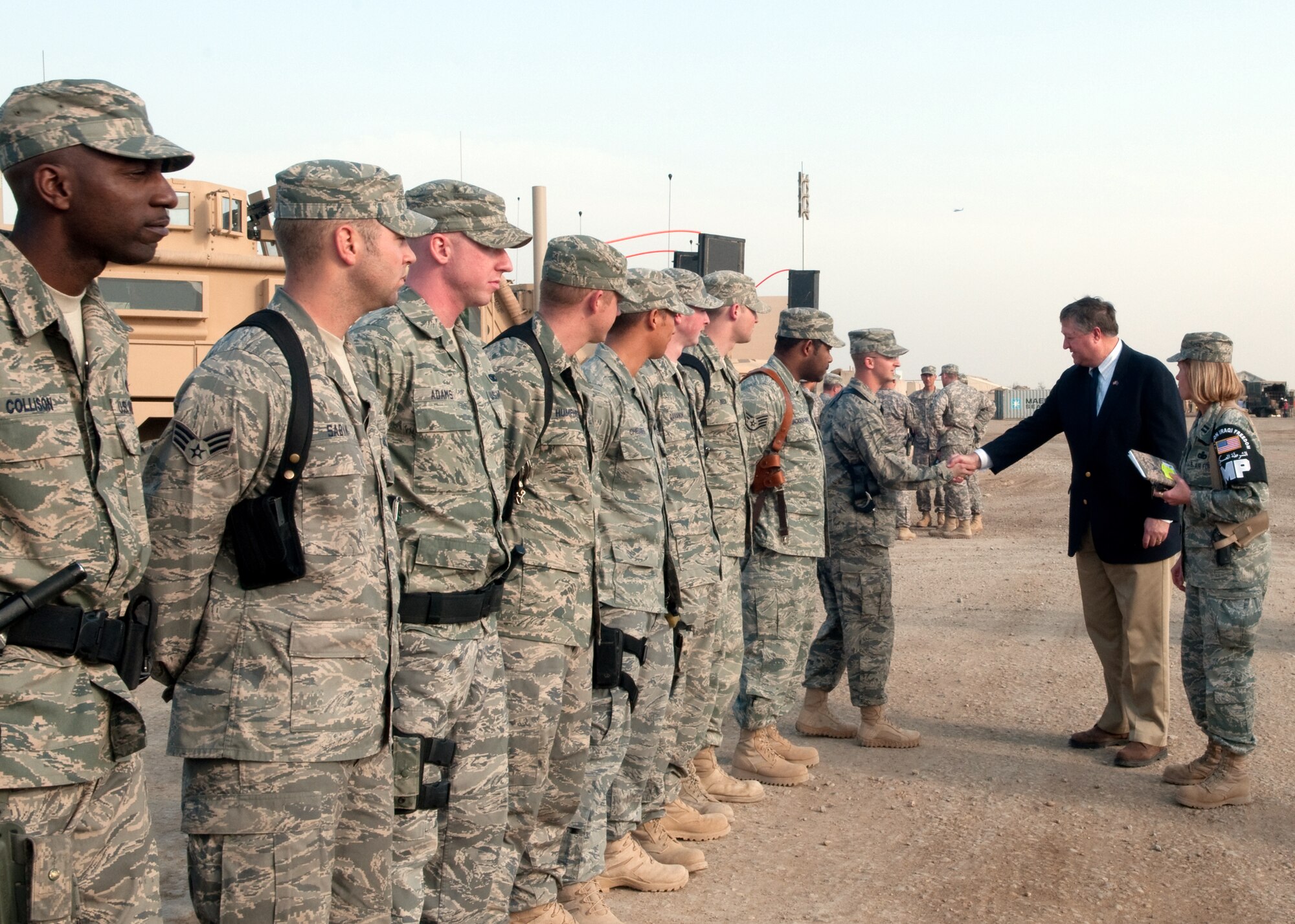 Capt. Jutta Arkan introduces her team of Joint Expeditionary Tasking Airmen to Secretary of the Air Force Michael Donley Jan. 31, 2010, during his visit to Ali Base, Iraq. Captain Arkan is the commander of the Provost Marshall's Office. The Joint Expeditionary Tasking Airmen are assigned to the U.S. Army, 4th Brigade Combat Team, 1st Armored Division, Special Troops Battalion. (U.S. Air Force photo /Senior Master Sgt. Elizabeth Gilbert)
