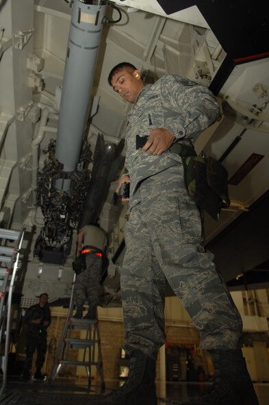 WHITEMAN AIR FORCE BASE, Mo., - Staff Sgt. David Seenauth, 509th Bomb Wing Aircraft Maintenance Squadron, fastens his tool belt during the Load Crew of the Year Competition Feb. 3, 2010.  Two highly trained four-man crews competed for the title.  The load crew of the year will be announced at the Maintenance Professional of the Year banquet in March.  (U.S. Air Force photo/Senior Airman Jessica Mae Snow) (Released)