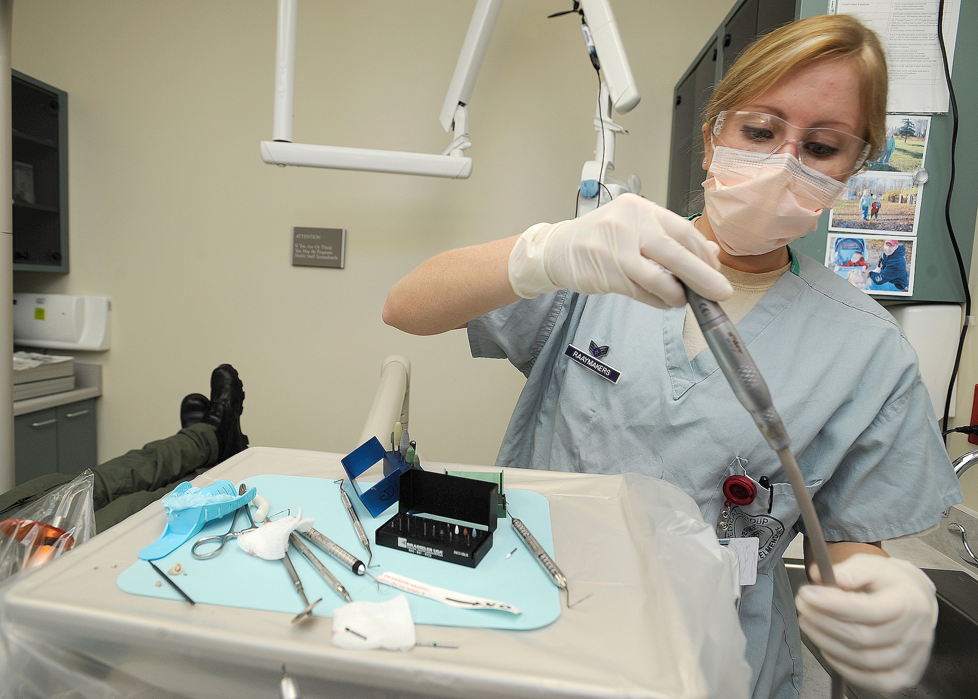 ELMENDORF AIR FORCE BASE, Alaska -- Senior Airman Shannon Raaymakers, 3rd Dental Squadron, replaces tools that were being used during a procedure Feb. 3. The tools were being used to place a cap on the patient's tooth.( Air Force photo/ Senior Airman Matt Coleman-Foster)