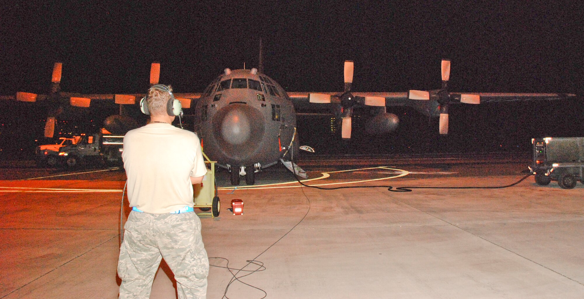 Tech. Sgt. Steve Pearson supervises the refueling of a C-130 Hercules, after its return from an Operation Unified Response mission Jan. 27, 2010, at Muniz Air Base, Puerto Rico. Sergeant Pearson is a 35th Expeditionary Airlift Squadron crew chief from the 302nd Airlift Wing, Peterson Air Force Base, Colo. (U.S. Air Force photo/Master Sgt. Stan Coleman)