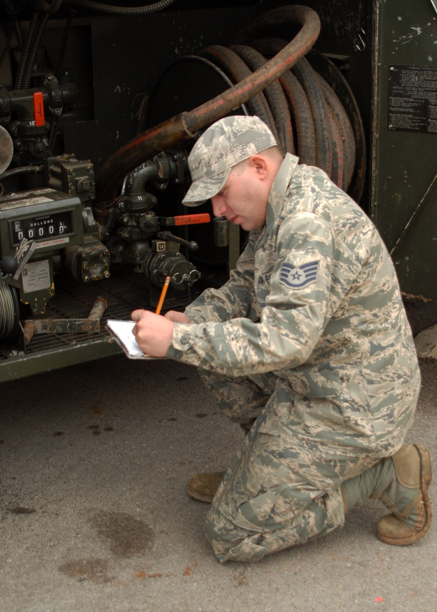 ALTUS AIR FORCE BASE, Okla. -- Staff Sgt. Steven O’Connor, 97th Logistics Readiness Squadron, checks the gauges on his tanker truck before refueling the generator at the Medical Clinic during Operation Ice Station Zebra Feb 3. Sergeant O’Connor ensures electricity is running to the medical clinic while working his 12-hour shift during the recovery operation to keep the power going for Airmen and their families taking shelter at the clinic. (U.S. Air Force photo/Airman 1st Class Christopher A. Arnold)