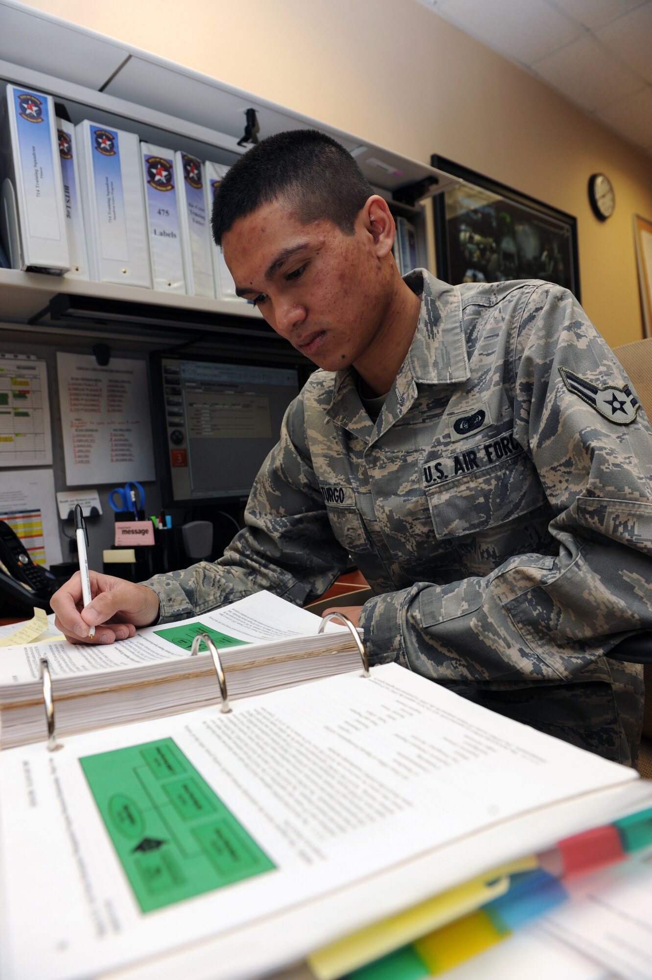 Airman 1st Class Nordavid Laturgo, 714th Training Squadron student administrator apprentice, checks, updates and tracks the student leave program Feb. 3 at the 714th TRS. Airman Laturgo was selected as the Combat Airlifter of the Week for managing the 314th Operations Group and 714th TRS fit program, designing a new War Fit tracker program for 59 personnel and having 100-percent compliance with annual testing. (U.S. Air Force photo by Senior Airman Ethan Morgan)