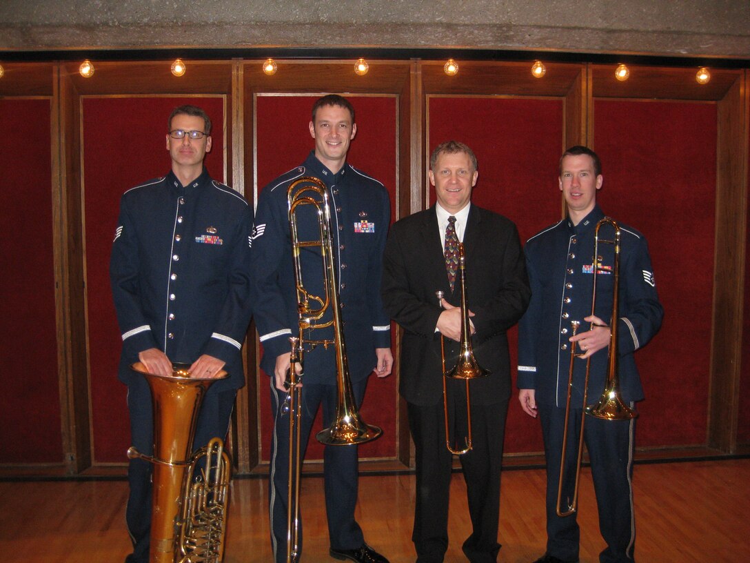 Members of the USAF Brass in Blue took part in UNOmaha's Low Brass Day on 2
February 2010.  SSgt Mark Barnette, SSgt Matthew Erickson, Mr. Mark Fisher,
and SSgt Ben Kadow pose for a picture after a performance for over 60 low
brass players and educators.  Mr. Fisher is the second trombonist of the
Chicago Lyric Opera Orchestra and served as the guest clinician for Low
Brass Day.