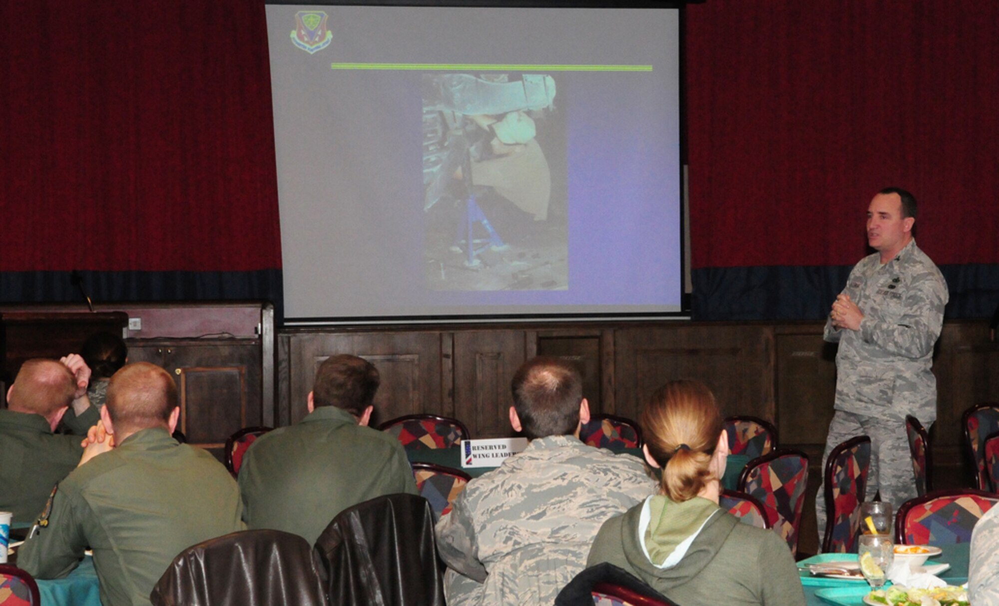 Col. Jeffery Bateman, 100th Mission Support Group commander, shares stories about his deployment to Al-Udeid Air Base, Southwest Asia, in 2001. As the security forces commander (and tent city mayor) he was on the initial team that built, from scratch, what later became known as Camp Andy, named after a member from the civil engineer squadron who was killed in a heavy equipment accident. Colonel Bateman said everyone built tents. "No matter what your (Air force Specialty Code), when you'd done your job for the day, you built tents," he said. (U.S. Air Force photo by Karen Abeyasekere)