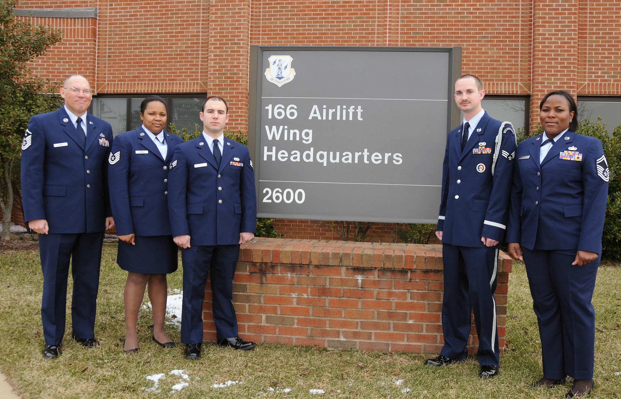 The Delaware Air National Guard's five Outstanding Airmen of the Year for FY 2009, all members of the 166th Airlift Wing located in New Castle, Del., gather in front of wing HQ on Feb. 2, 2010. The Airmen are (L to R): First Sergeant of the Year, Master Sgt. Glenn Davis, 166th Civil Engineer Squadron, and a resident of West Grove, Pa.; Noncommissioned Officer of the Year, Tech. Sgt. Tracy Ashman, 166th Force Support Squadron, and a resident of Bear, Del.; Airman of the Year, Senior Airman Benjamin Fileti, 166th Maintenance Squadron, and a resident of Hockessin, Del.; Honor Guard Member of the Year, Senior Airman Joel Miller, 166th Maintenance Squadron, and a resident of Newark, Del.; Senior Noncommissioned Officer of the Year, Senior Master Sgt. Patrina Obey, 166th Logistics Readiness Squadron, and a resident of Smyrna, Del. (U.S. Air Force photo/Senior Master Sgt. Gerald Dougherty, Delaware ANG)