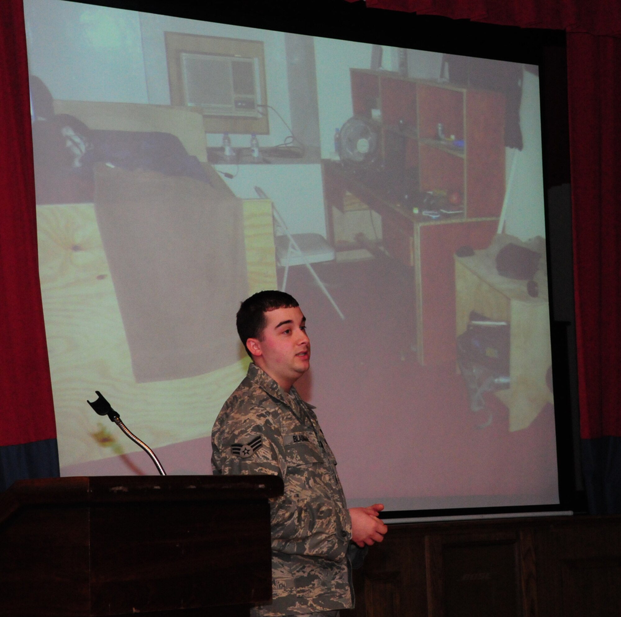 Senior Airman Andrew Blasiman, 100th Communications, talks about his deployment to Forward Operating Base Maholic, Kandahar, Afghanistan, at a "Warrior stories" event Feb. 4 at the Galaxy Club. Airman Blasiman deployed with the Army, and said he got to sleep on a plywood bed, adding that made them some of the lucky ones. He deployed as a special forces deployable node technician, and said he came under rocket fire the minute he stepped off the plane at his deployed location. (U.S. Air Force photo/Karen Abeyasekere)