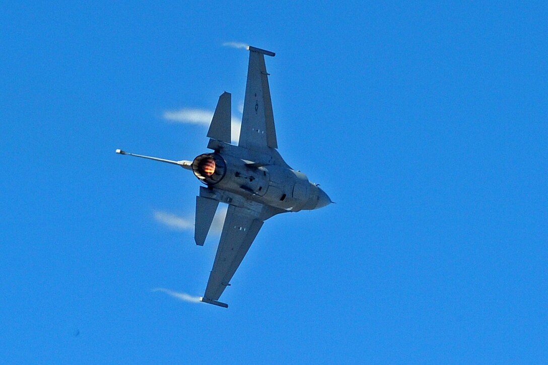 LANGLEY AIR FORCE BASE, Va. -- Capt. Ryan "Rider" Corrigan, F-16 Viper East Demonstration Team pilot, performs for Gen. William M. Fraser III, Air Combat Command commander, Feb. 3. The demonstration team flew as part of the Commander Air Combat Command certification flight.  (U.S. Air Force photo/Senior Airman Zachary Wolf)