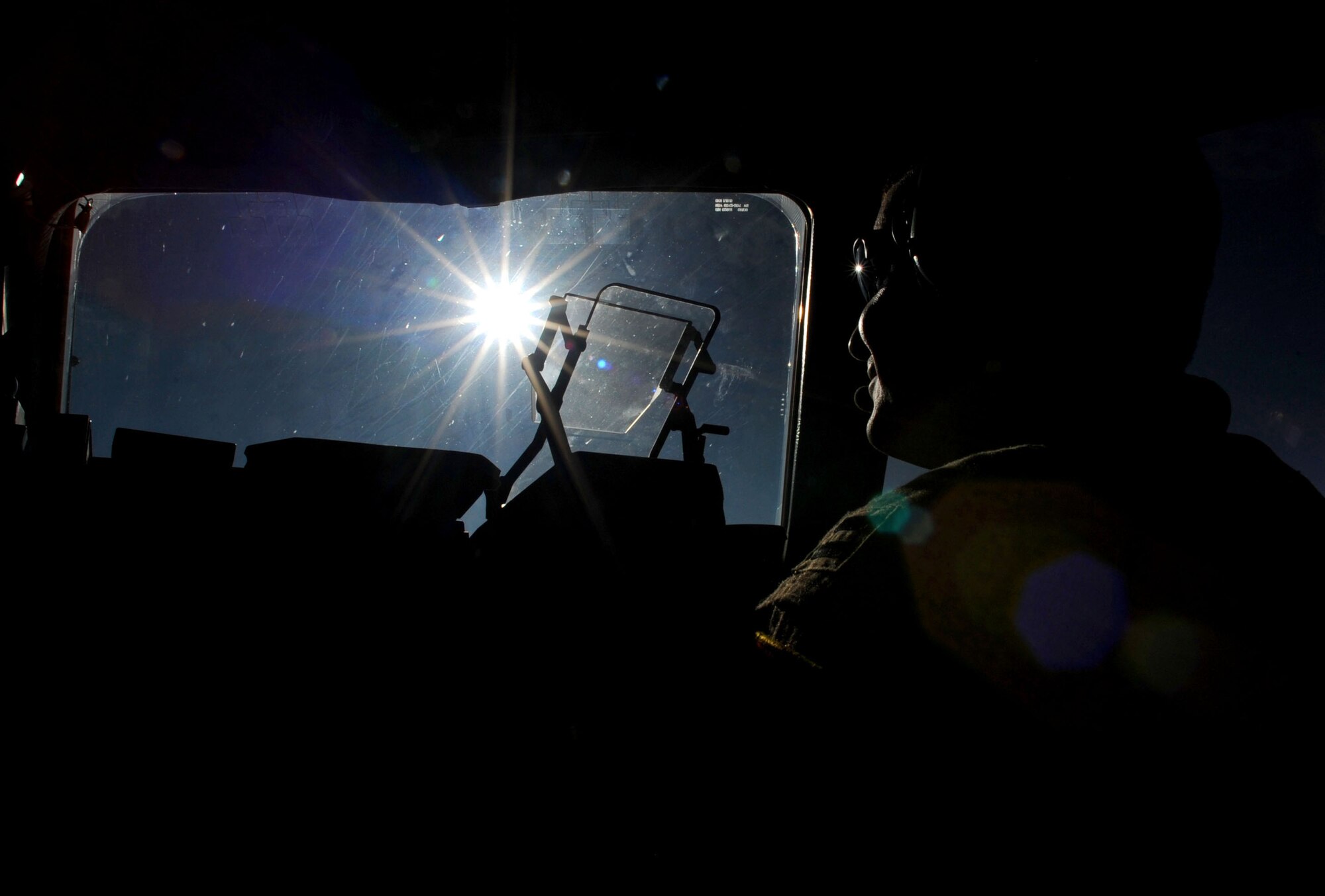 U.S. Air Force Capt Daniel Godwin, 816th Expeditionary Airlift Squadron C-17 Globemaster III pilot, flies over Southwest Asia after an airdrop mission, Feb. 2, 2010.  The aircrew dropped 34 container delivery system bundles to ground forces at a forward-operating base in Afghanistan.  (U.S. Air Force photo/Staff Sgt. Angelita Lawrence/released)