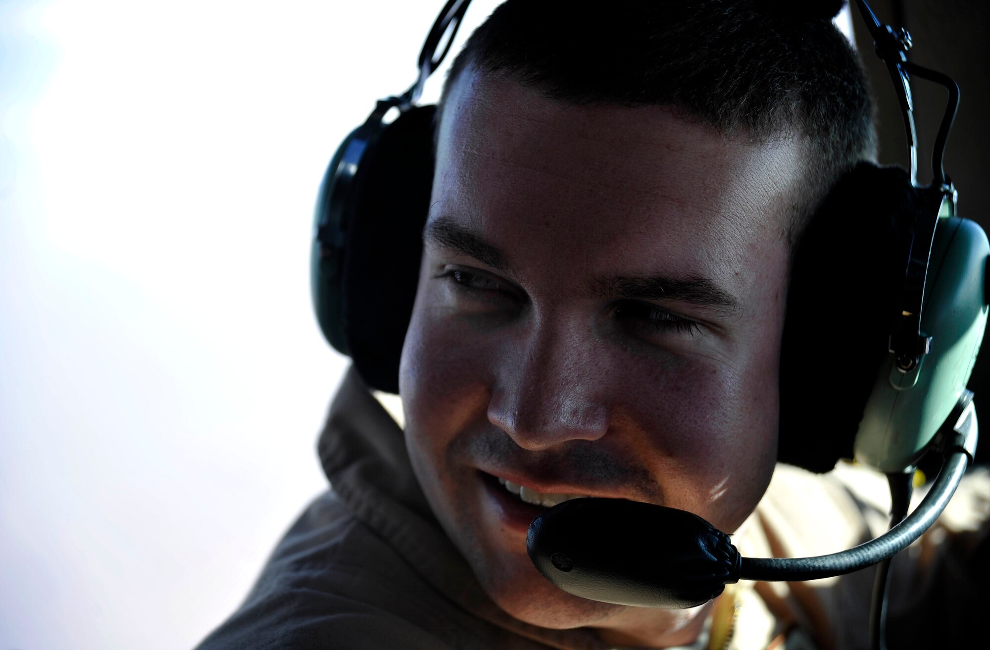 U.S. Air Force Capt. Derek Dupuis, 816th Expeditionary Airlift Squadron C-17 Globemaster III pilot, discusses a flight plan while flying over southwest Asia Feb. 2, 2010.  The crew had just completed a re-supply mission dropping 34 containerized delivery system bundles over a base in Afghanistan.  (U.S. Air Force photo/Staff Sgt. Angelita Lawrence/released)