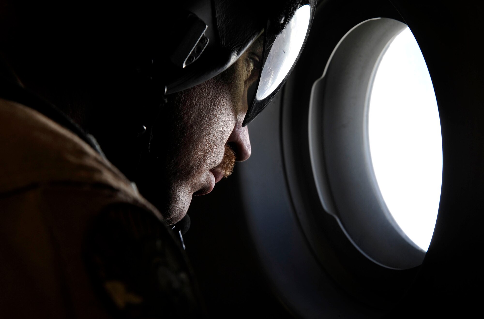 U.S. Air Force Tech. Sgt. Kevin Owen, 816th Expeditionary Airlift Squadron loadmaster, completes an inspection of an engine prior to completing an airdrop mission over Afghanistan, Feb. 2, 2010.  The crew, flying a C-17 Globemaster III, will deliver 34 containerized delivery system bundles to ground forces operating from a remote location.  (U.S. Air Force photo/Staff Sgt. Angelita Lawrence/released)