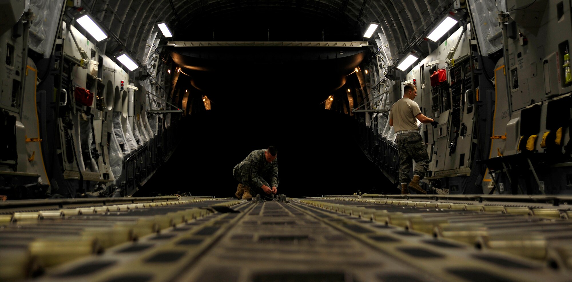 U.S. Air Force Tech. Sgt. Todd O' Bryant, 816th Expeditionary Airlift Squadron loadmaster, does a pre-flight inspection aboard a C-17 Globemaster III, prior to launching an airdrop mission, Feb. 2, 2010, in Southwest Asia.  (U.S. Air Force photo/Staff Sgt. Angelita Lawrence/released)