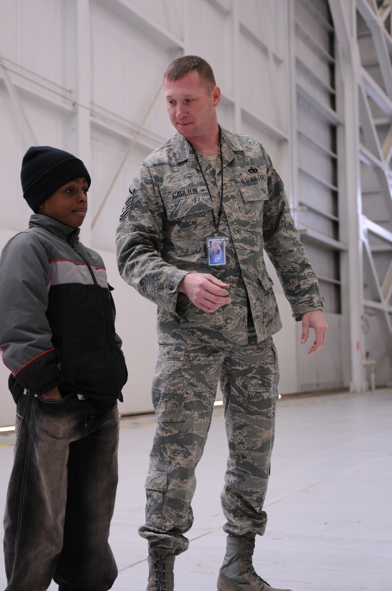 A member of the youth tour group listens to Master Sgt. Richard Carlton, 459th Maintenance Squadron, crew chief, describe the capabilities of the KC-135R Stratotanker here Jan. 9 at a static display.