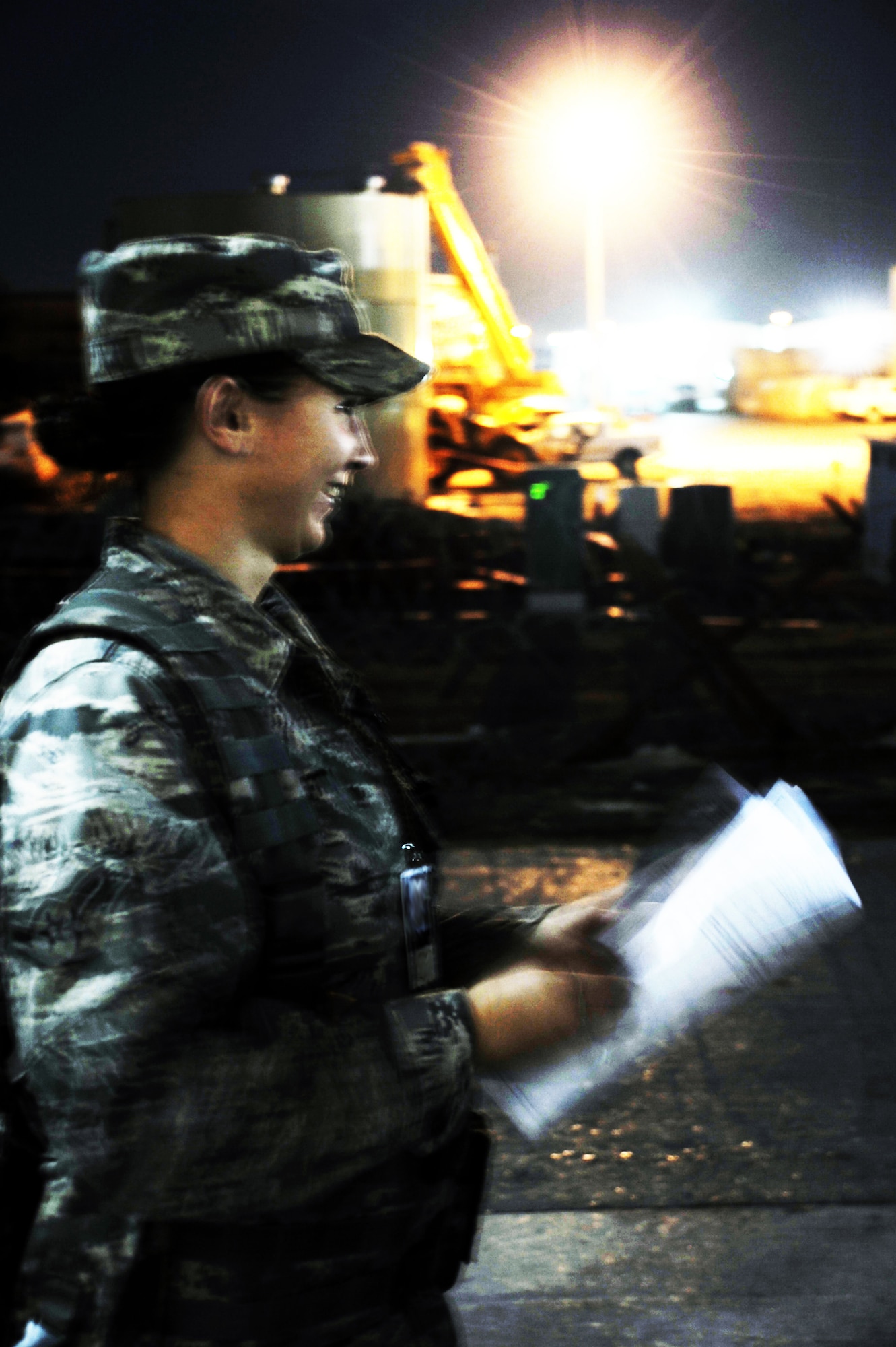 Airman Lyndee Bennett, security forces journeyman with the 380th Expeditionary Security Forces Squadron, finishes working on a police report while working a night shift during operations at a non-disclosed location in Southwest Asia.  Airman Bennett is deployed from the 95th Security Forces Squadron at Edwards Air Force Base, Calif., and her hometown is Wichita, Kan. (U.S. Air Force Photo/Master Sgt. Scott T. Sturkol/Released)