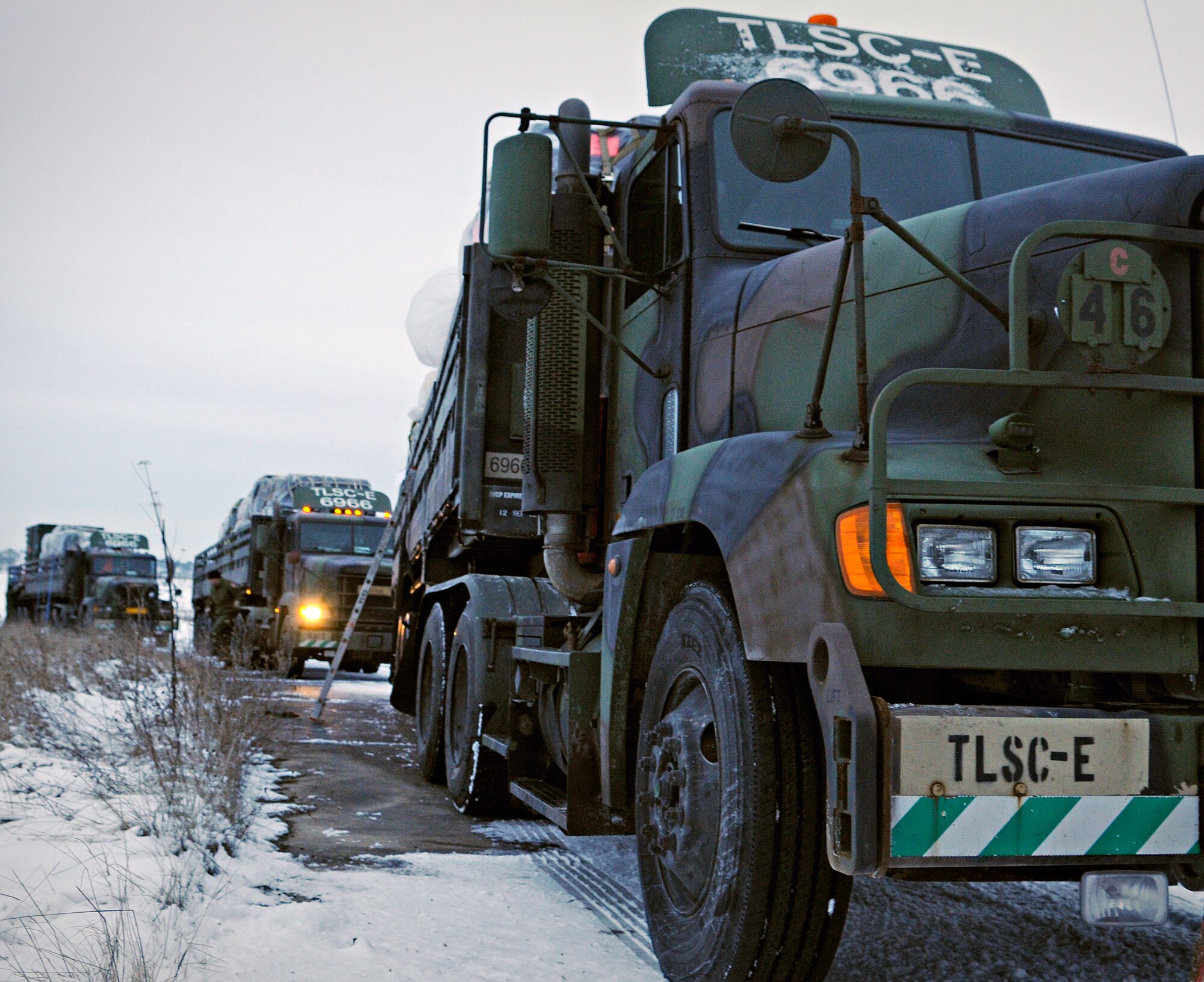FLUGPLATZ BITBURG, Germany – Trucks carrying cargo to members of Ramstein Air Base, Germany, line the flightline of Flugplatz Bitburg during an operational readiness exercise Jan. 27. Members from Ramstein’s 435th Air Ground Operations Wing and the 86th Airlift Wing worked together to set up bare-base operations at Flugplatz Bitburg. This was the second of five OREs Ramstein is performing to prepare for an inspection in September. (U.S. Air Force photo/Senior Airman Benjamin Wilson)