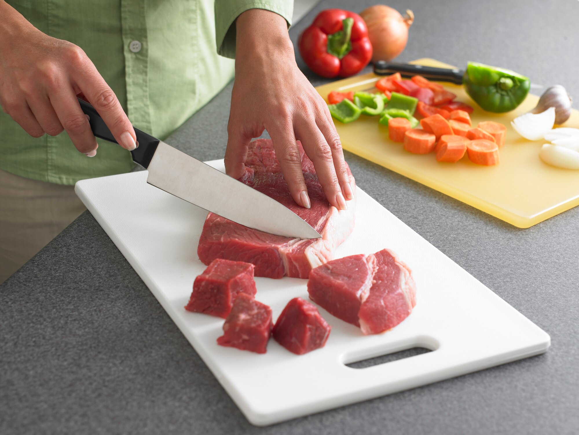 United States Department of Agriculture experts recommend prevent "encroachment" at home on Super Bowl Sunday by keeping each "team" in its own zone. The juices from raw meat can contain harmful bacteria that cross-contaminate other food. (USDA Photo)