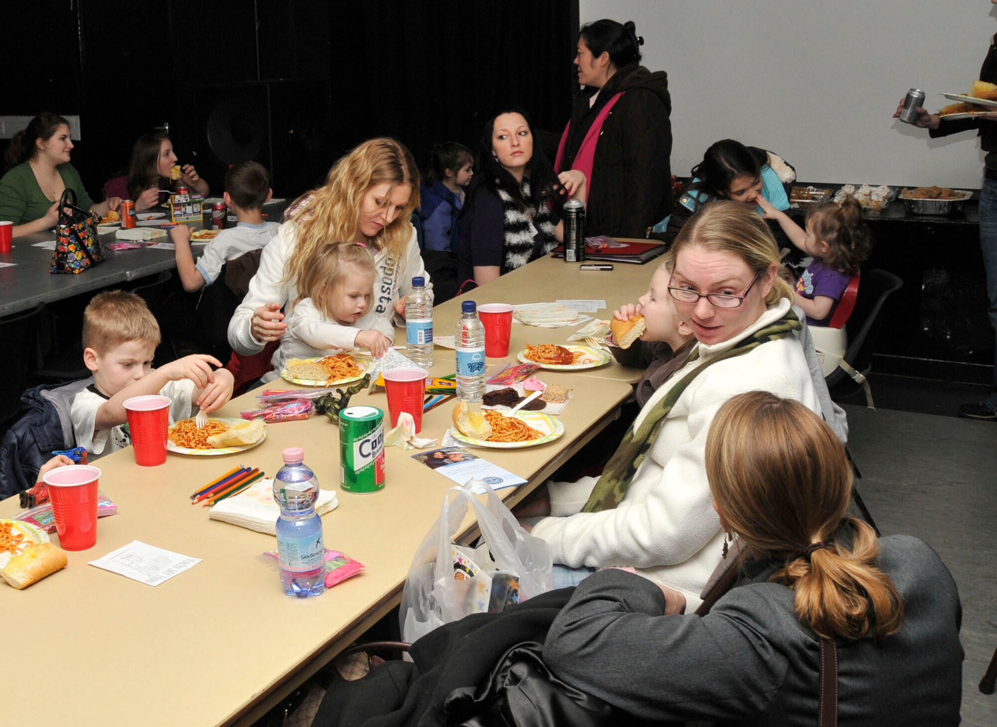 Families of Deployed military members come together to enjoy a meal and the company of like families at the 48th Community Center on RAF Lakenheath, England. The dinner provides service members’ spouses a night off from cooking and an opportunity to meet with others.  (U.S. Air Forces photo/ Airman 1st Class Knox)