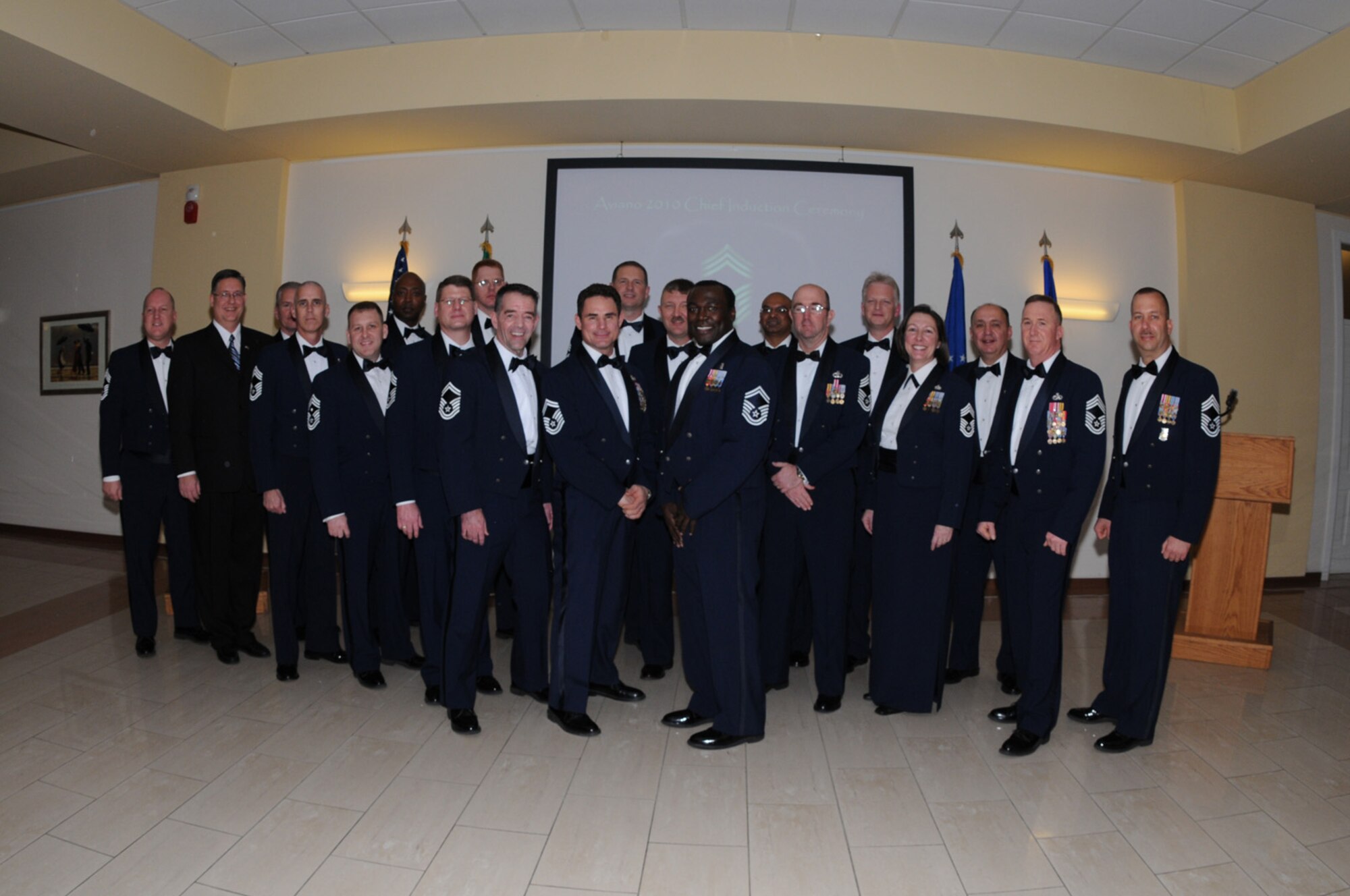 Senior Master Sgts. Anthony Grizzard, Jeff Malherek and Gregory Banks (center) are all smiles during the Chief's Recognition Ceremony held in Aviano, Italy on Jan. 30, 2010. Sergeants Grizzard, Malherek and Banks, and Senior Master Sgt. David Ayers (not present) are Aviano Air Base’s newest chief master sergeant selects. (U.S. Air Force photo/Staff Sgt. Mercedes Crossland)