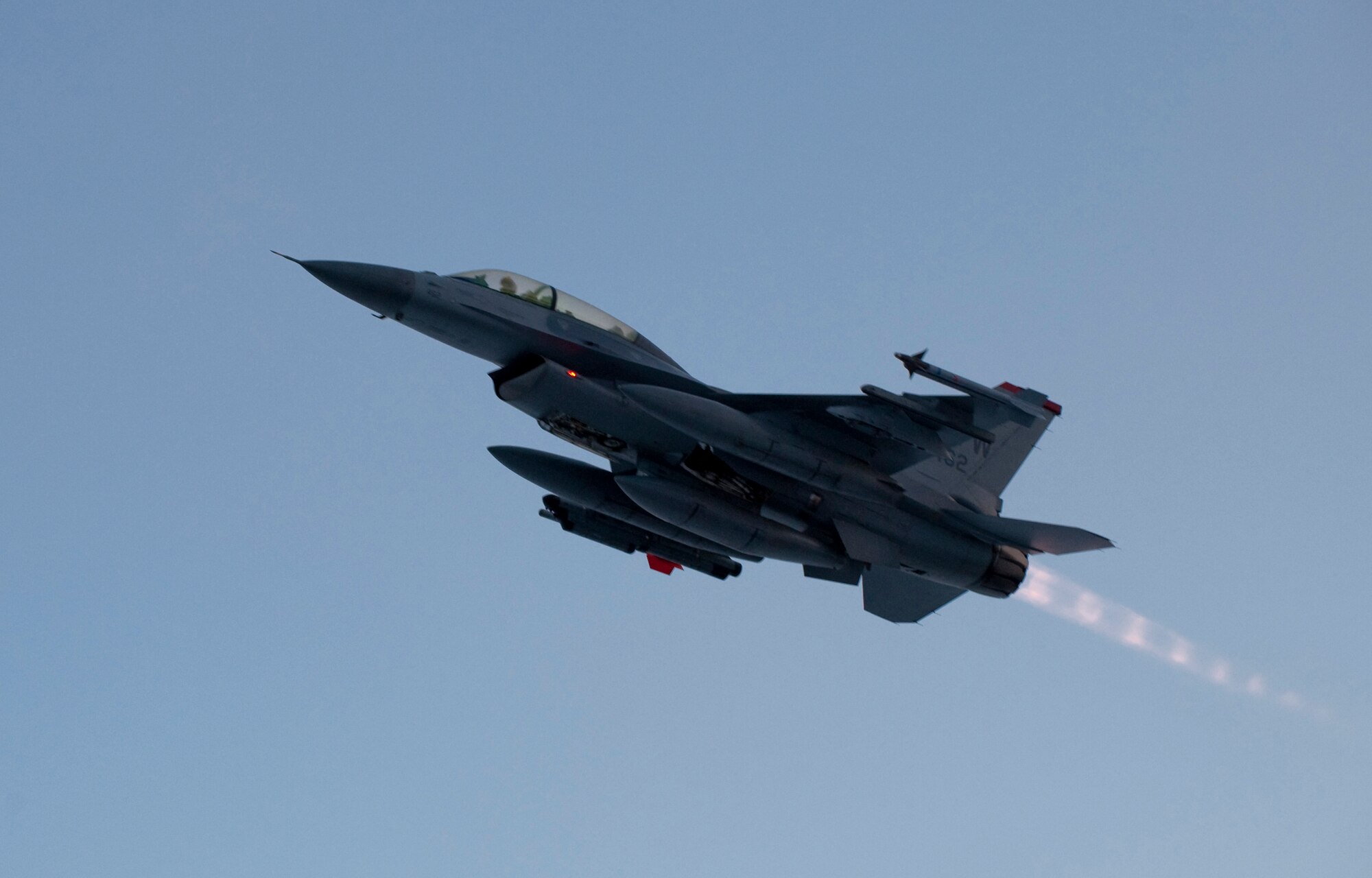 MISAWA AIR BASE, Japan -- Capt. Craig Phelps, 14th Fighter Squadron pilot, ascends from the runway in a predawn takeoff Feb. 3. The F-16 can fly more than 500 miles, deliver its weapons with superior accuracy, defend itself against enemy aircraft, and return to its starting point. (U.S. Air Force photo/Staff Sgt. Samuel Morse)