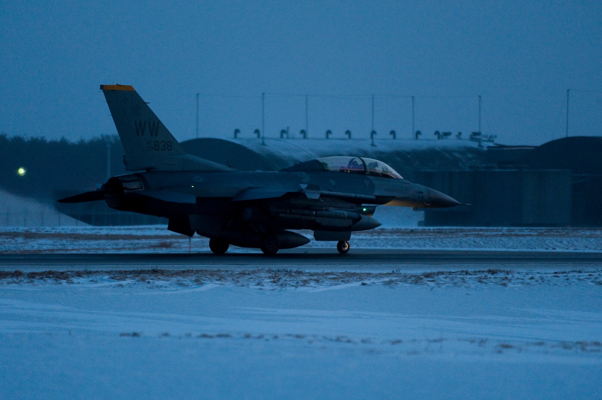 MISAWA AIR BASE, Japan -- Capt. Cory Farrer, 13th Fighter Squadron pilot, taxis an F-16 Fighting Falcon toward the runway for a predawn takeoff Feb. 3. The F-16 was the first fighter jet to employ a "fly-by-wire" control system. (U.S. Air Force photo/Staff Sgt. Samuel Morse)