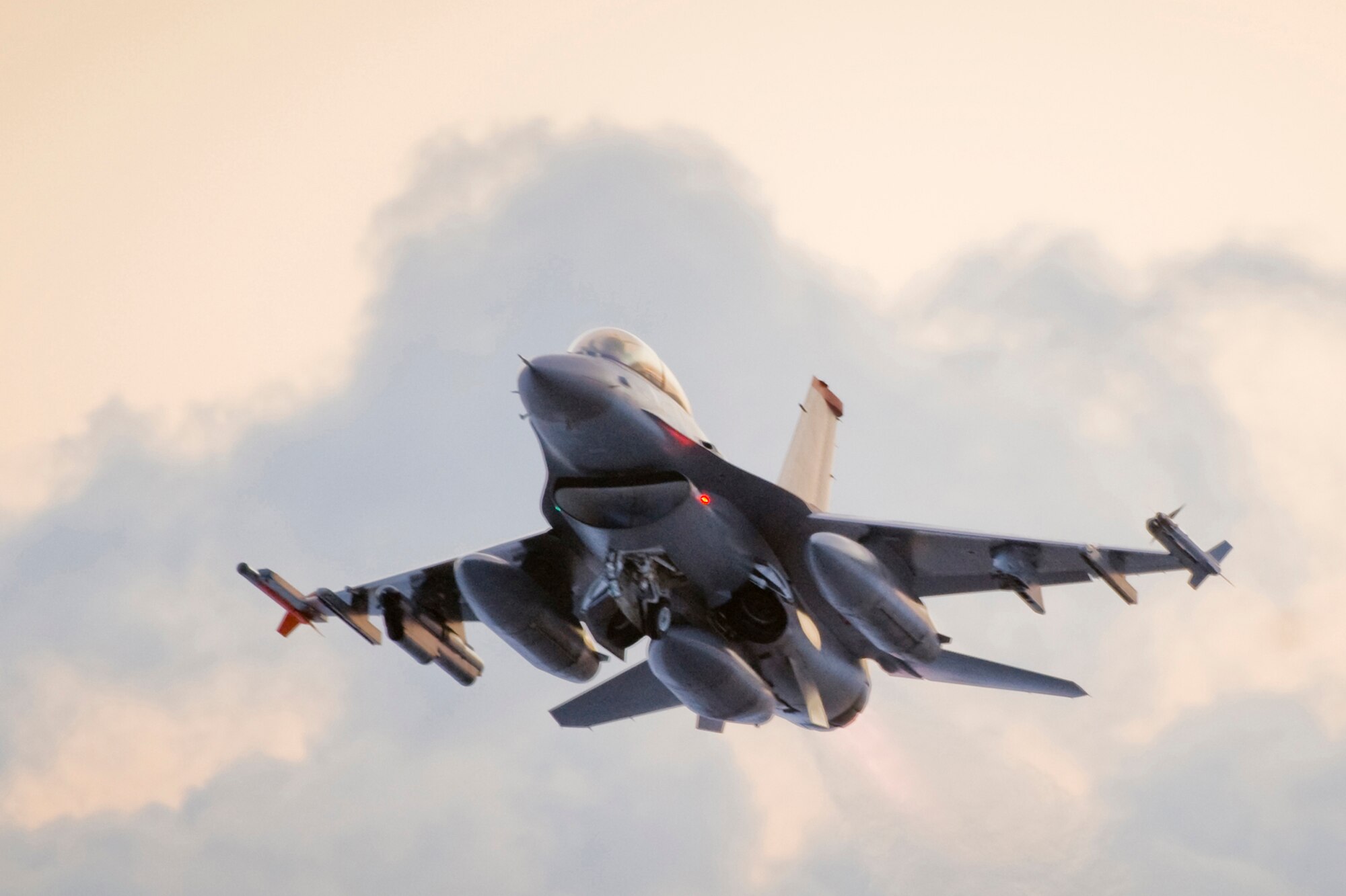 MISAWA AIR BASE, Japan -- While piloting an F-16 Fighting Falcon, Capt. Craig Phelps takes off into the Misawa morning sky Feb. 3 during Exercise Beverly Sunrise 10-01. Throughout the exercise, Airmen prepared, flew and maintained F-16s as base personnel trained to test their deployed-operational skills. (U.S. Air Force photo/Senior Airman Jamal D. Sutter)