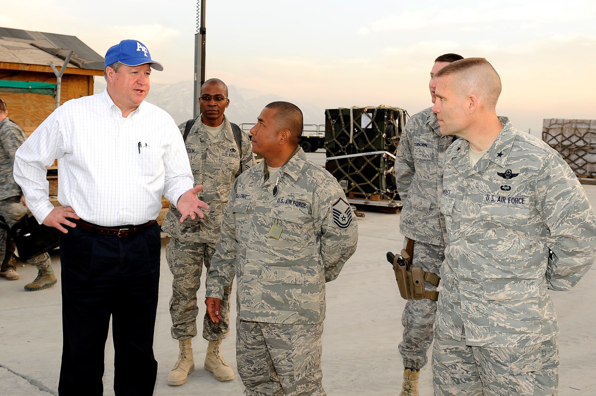 BAGRAM AIRFIELD, Afghanistan--Secretary of the Air Force Michael Donley
discusses aerial port operations with U.S. Air Force Brig. Gen. Steven Kwast, commander, 455th Air Expeditionary Wing, U.S. AF Master Sgt. Alvin Dela Cruz, and Chief Master Sgt. William Jackson of the 455th Expeditionary Aerial Port Squadron on Bagram Airfield, Feb. 2, 2010. Secretary Donley was in Afghanistan to monitor the training efforts of the Afghanistan National Army Air Corps and to meet with Airmen.  (U.S. Air Force photo by/ Tech. Sgt. Jeromy K. Cross)
