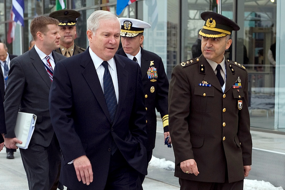 U.S. Defense Secretary Robert M. Gates walks with Turkish Lt. Col. Zafer Ali Ozsoy in Istanbul, Feb. 4, 2010.