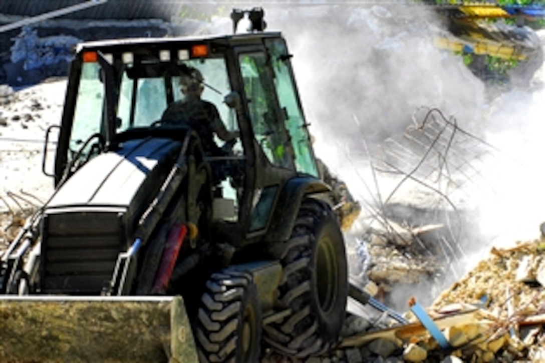 A U.S. Navy Seabee removes rubble from a collapsed church in Baie De Grand-Grove, Haiti, Jan. 28, 2010. The Seabee is assigned to Amphibious Construction Battalion 2, embarked aboard the USS Carter Hall. The Carter Hall is conducting humanitarian and disaster relief operations as part of Operation Unified Response after an earthquake devastated Haiti, Jan. 12, 2010.