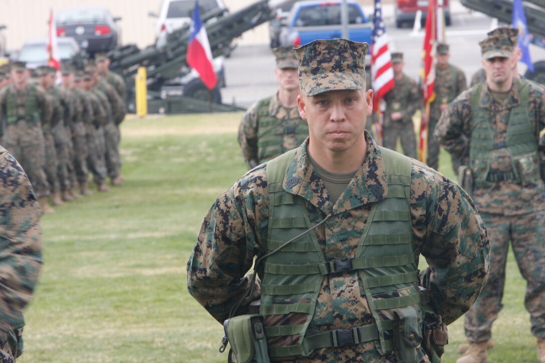 Artiom Kolovo, a recruit with Plt. 2008, Fox Co., 2nd RTBn., lifts barbed wire with his rifle as he makes his way through the day movement course. Kolovo is an immigrant from Samara, Russia.