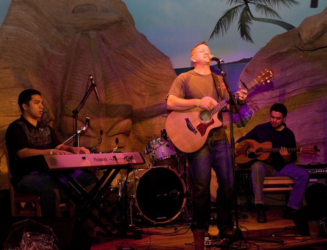 The Mike Corrado Band performs “Start Saving Me,” one of Lt. Col. Mike Corrado’s original songs, during the Perry and Price show at Jimmy Buffett’s at the Beachcomber here Feb.6. The band beat more than 50 competitors for a chance to open for Bon Jovi Feb. 12.