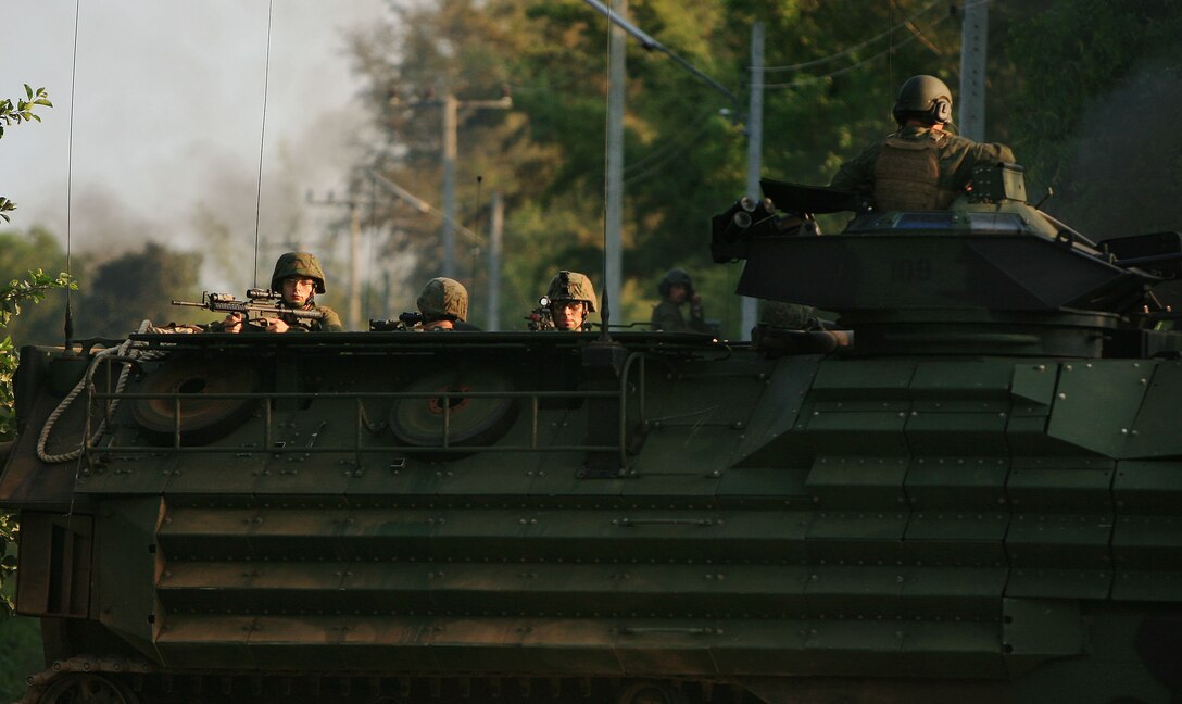 Royal Thai Marines on their amphibious assault vehicle (AAV) provide security during an assault on a hostile position during a mechanized raid, Feb. 5. The 31st Marine Expeditionary Unit (MEU) is currently participating in exercise Cobra Gold 2010 (CG’ 10). The exercise is the latest in a continuing series of exercises design to promote regional peace and security.