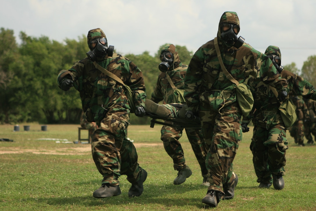 The Royal Thai Marine Corps team sprints for the finish line during a race in Mission Oriented Protective Posture (MOPP) level four gear as part of a Chemical Biological Radiological Nuclear (CBRN) training exercise, Feb. 5. The 31st Marine Expeditionary Unit (MEU) is currently participating in exercise Cobra Gold 2010 (CG’ 10). The exercise is the latest in a continuing series of exercises design to promote regional peace and security. (Official Marine Corps photo by Lance Cpl. Dengrier M. Baez)
