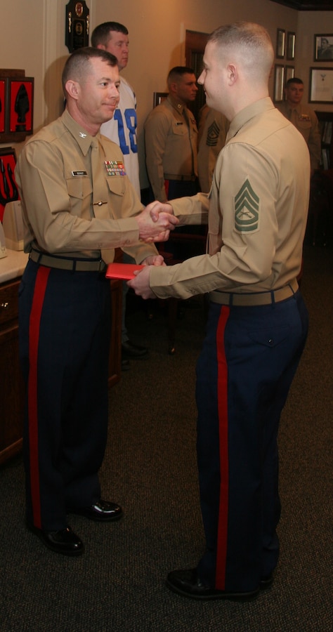 GySgt. Joshua Shaffer, SNCOIC or RSS Kokomo, is awarded the elusive title of Centurion after only 21 mos as a canvassing recruiter.  Shaffer enlisted 100 qualified young men and women, 80 percent in the upper mental groups and all them were Tier 1, High School Graduates.
