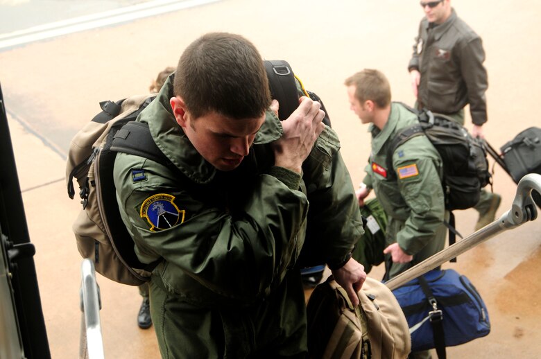 ALTUS AIR FORCE BASE, Okla. – Capt. Jake Fox, a student pilot from the 97th Training Squadron, boards a C-17 Globemaster III Feb  4. Pilots from Altus Air Force Base relocate to Kelly AFB to resume training due to the severe ice storm that swept through the area Jan. 28. (U.S. Air Force photo/Airman 1st Class Myles T. Stepp)