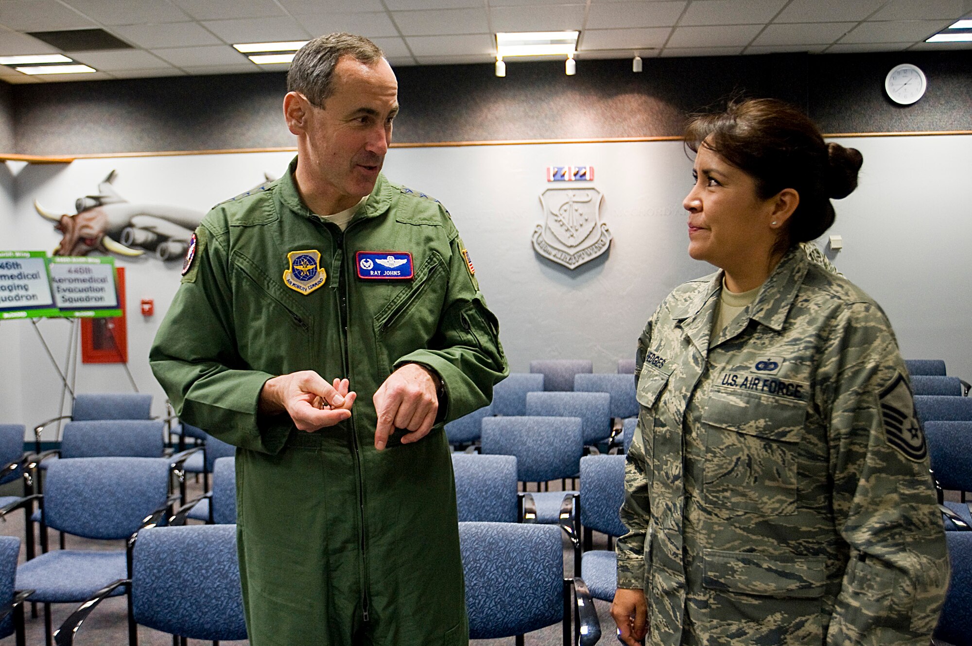 Gen. Raymond Johns, Air Mobility Command commer, talks with Master Sgt. Cheryl Hedges, 446th Airlift Wing during a meeting with 446th Airlift Wing Reserve Airmen and civilians Jan. 23 while visiting to McChord. (U.S. Air Force photo/Abner Guzman)