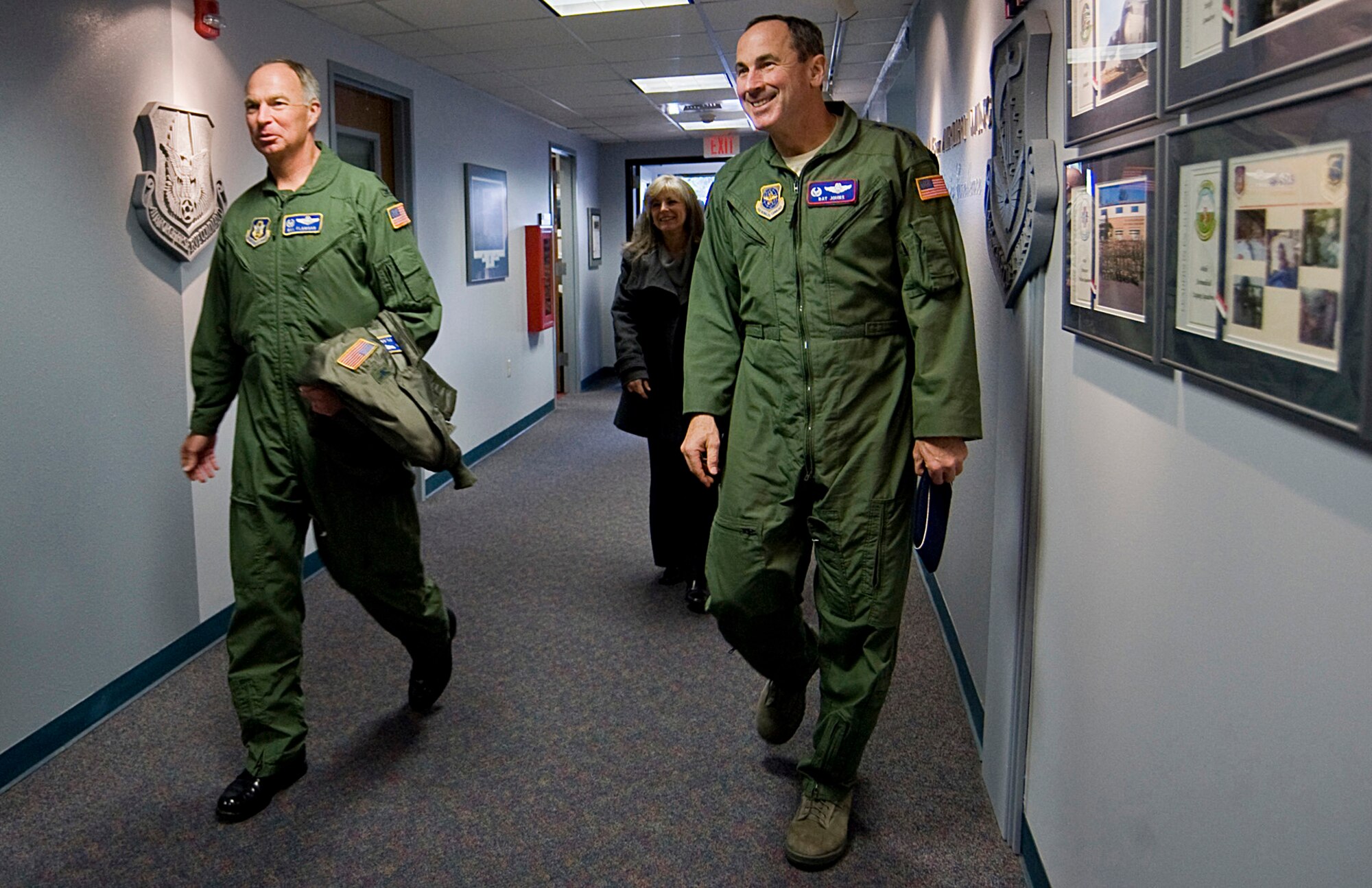 Col. William Flanigan, 446th Airlift Wing commander, left, escorts Gen. Raymond Johns, Jr., Air Mobility Command commander, through the 446th Airlift Wing headquarters Jan. 23. While visiting McChord Air Force Base, Wash.,  General Johns met with 446th AW Reserve Airmen and civilians. (U.S. Air Force photo/Abner Guzman)
