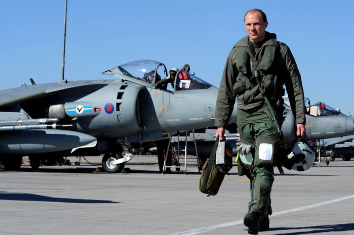 Flight Lt. James Calvert, Royal Air Force, Cottesmore, United Kingdom, walks toward his GR9 Harrier for a training mission while deployed to Red Flag 10-2,  Nellis Air Force Base, Nev., Feb. 3, 2010.  Red Flag is a realistic combat training exercise involving the air forces of the United States and its allies. The exercise is conducted on the 15,000-square-mile Nevada Test and Training Range, north of Las Vegas. (U.S. Air Force photo by Lawrence Crespo/RELEASED)