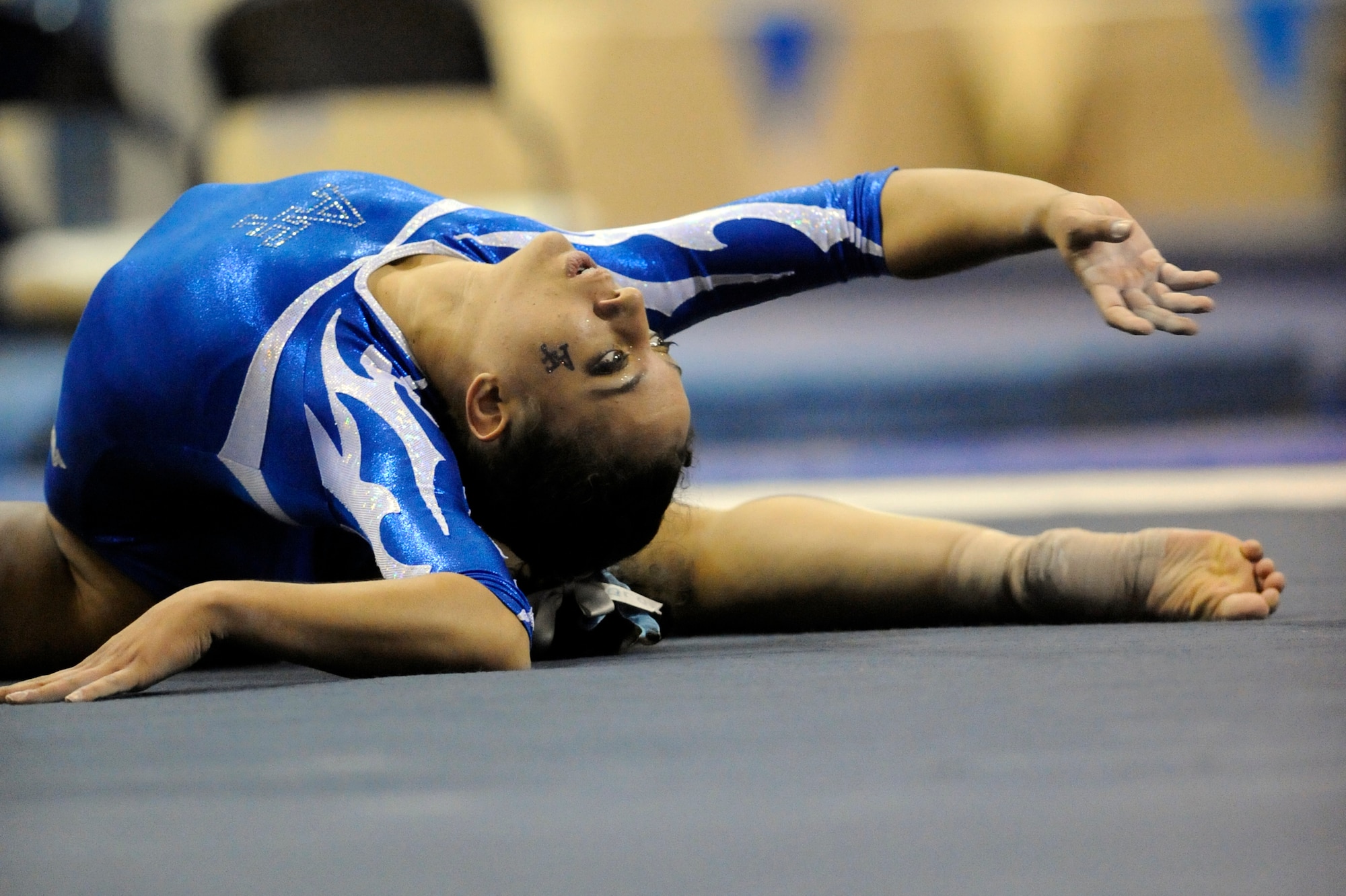 Freshman Tara Harris holds a pose as part of her floor routine during Air Force's women's gymnastics meet against UC Davis at the Air Force Academy's Cadet Gymnasium Jan. 30, 2010. Harris, a native of Gilroy, Calif., scored a  career-best 9.275 in the event. (U.S. Air Force photo/J. Rachel Spencer)