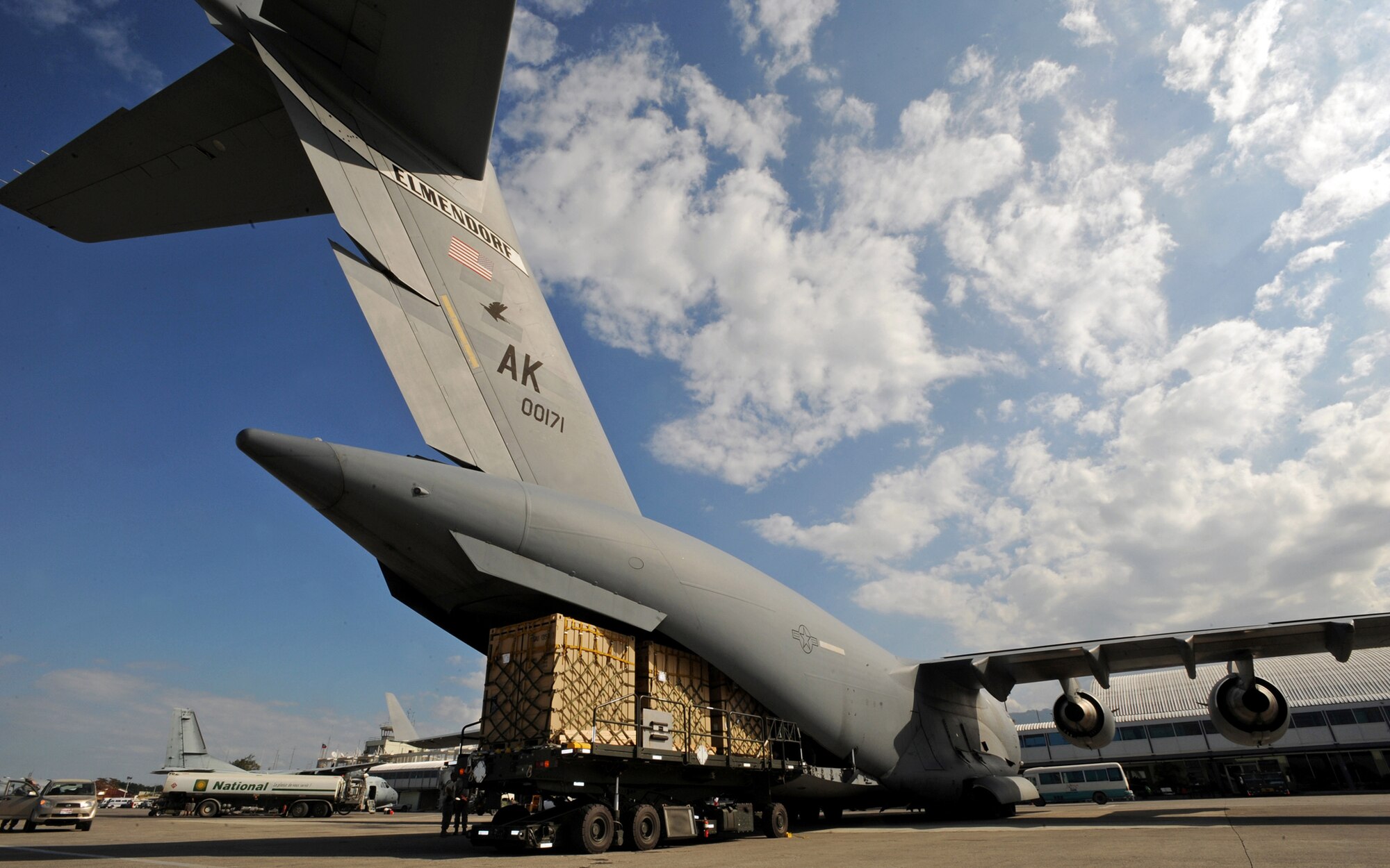 Cargo pallets are removed from a C-17 Globemaster III Jan. 31, 2010, at Port-Au-Prince, Haiti. The C-17 delivered Soldiers, a truck with water tank, and pallets of gear to be used in the Haiti relief effort. (U.S. Air Force photo/Senior Airman Laura Turner)