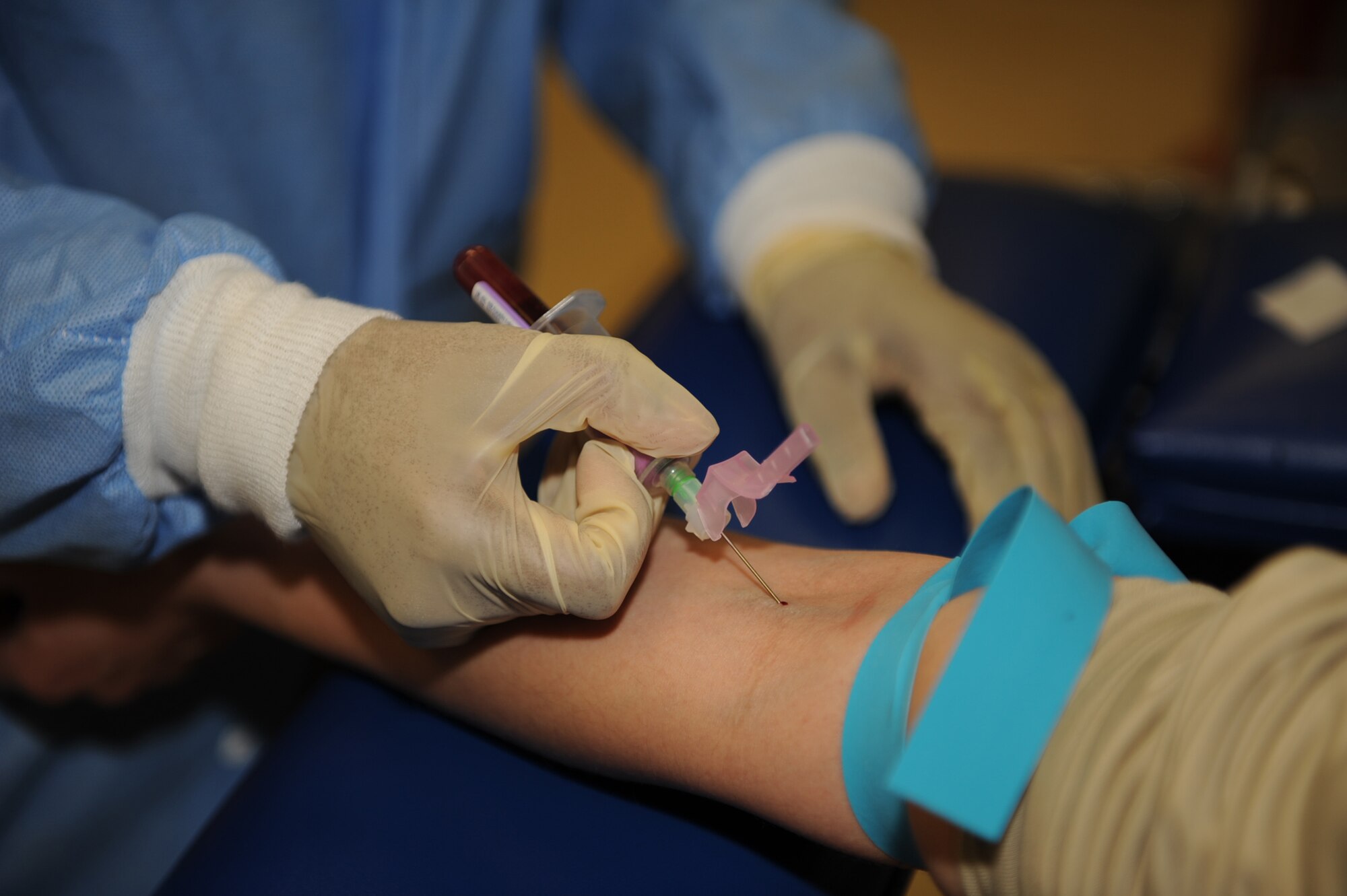 Tech. Sgt. Jacqueline Just, 4th Medical Support Squadron lab technician, takes a blood sample from a patient on Seymour Johnson Air Force Base, N.C., Feb. 4, 2010. Members of the 4th MDOS lab draw blood from more than 1,500 patients a month. Just is from Charleston, S.C. (U.S. Air Force photo/ Senior Airman Ciara Wymbs)