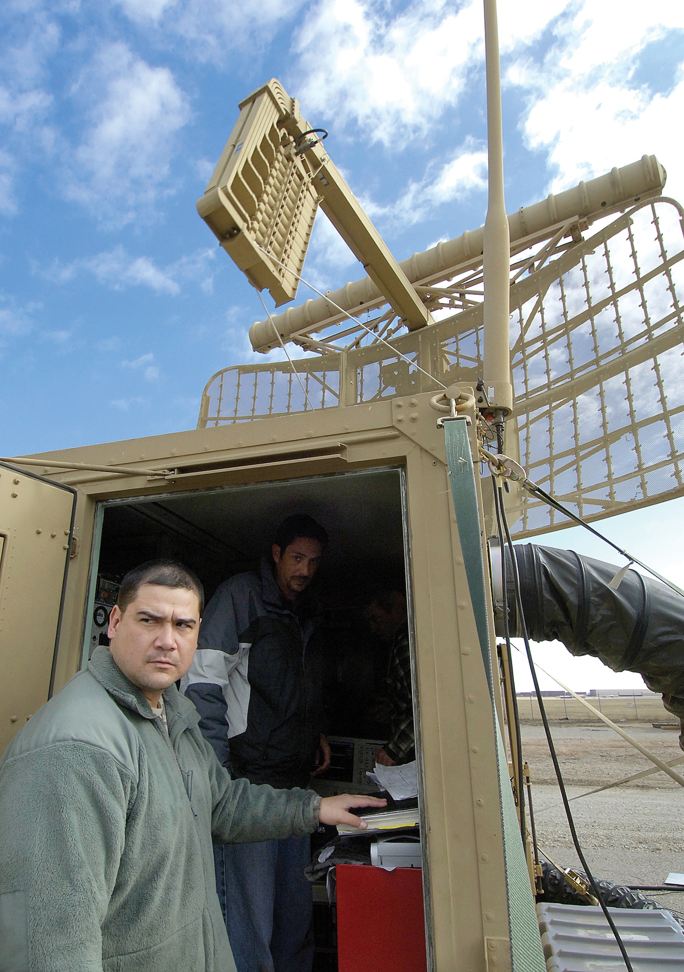 Staff Sgt. Sean Jones and other 32nd Combat Communications Squadron personnel test a TPN-19 radar system that will be sent with members of the squadron to Haiti in support of recovery efforts to the battered area. (Air Force photo by Margo Wright)