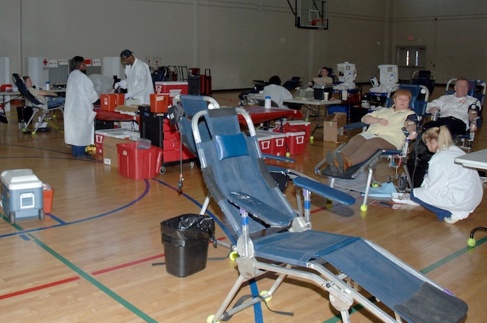 Members of Joint Team Charleston occupy a majority of the chairs while an empty chair waits for the next member to sit down to donate blood during the Joint Base Charleston blood drive held at the Fitness and Sports Center Feb. 3. The American Red Cross Charleston Service Center held the event to reach their goal of collecting 98 pints of blood during this month's blood drive. (U.S. Air Force photo/Staff Sgt. Marie Brown)