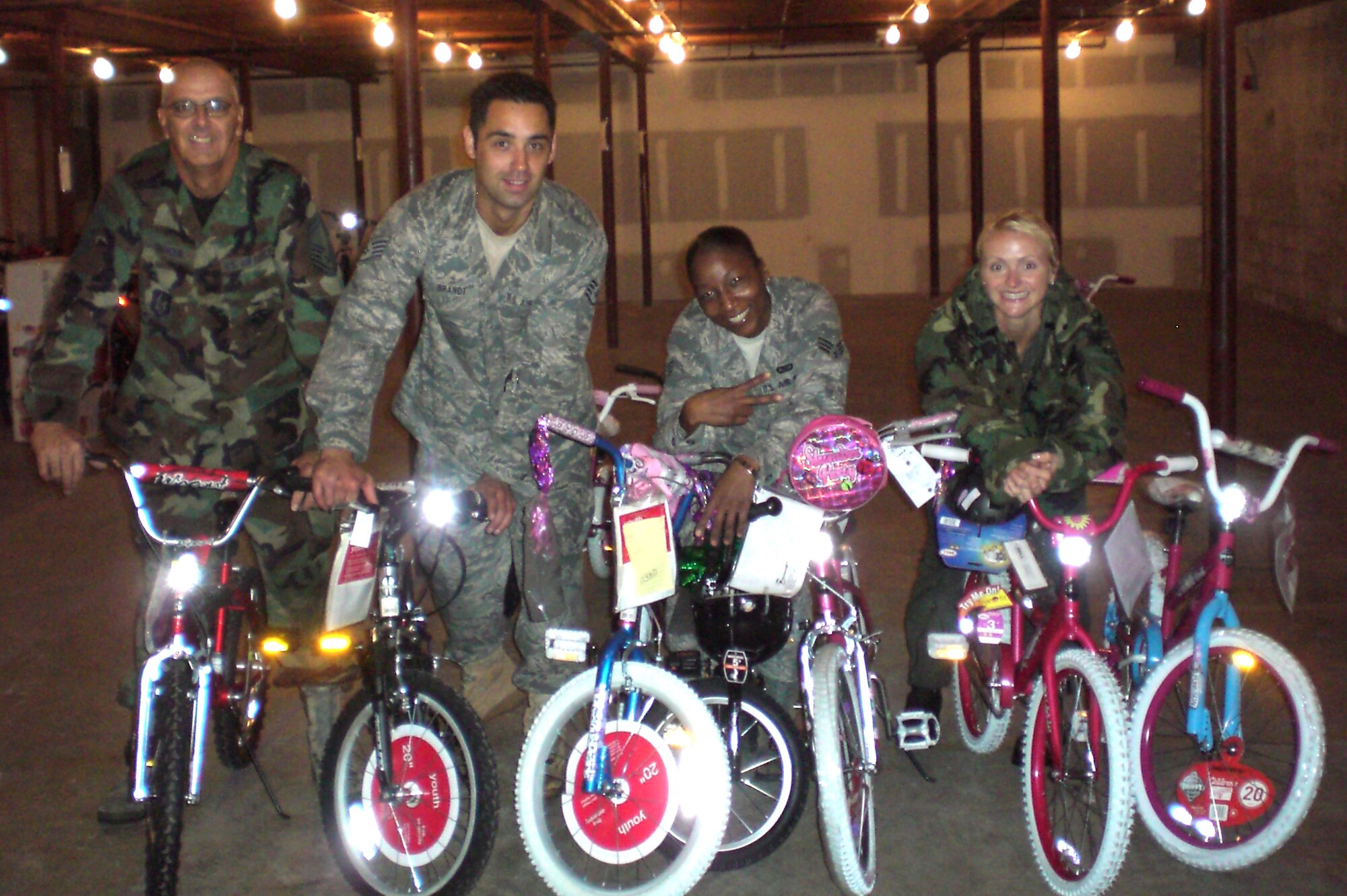 PATRICK AIR FORCE BASE, Fla. -  Air Force Reservists from the 920th Rescue Wing volunteer their time during the holiday season to help the Salvation Army. Senior Master Sgt. Bruce Lininger, Staff Sgt. Ron Brandt, Airman First Class Henrietta Hurd and Tech. Sgt. Jennifer Harris show some of the bikes they delieverd to families in need during their volunteer days at the Salvation Army. The Human Resources Development Council is an integral part of the U.S. Air Force Reserves and the 920th Airmen support the mission by working in community outreach programs. (U.S. Air Force photo)