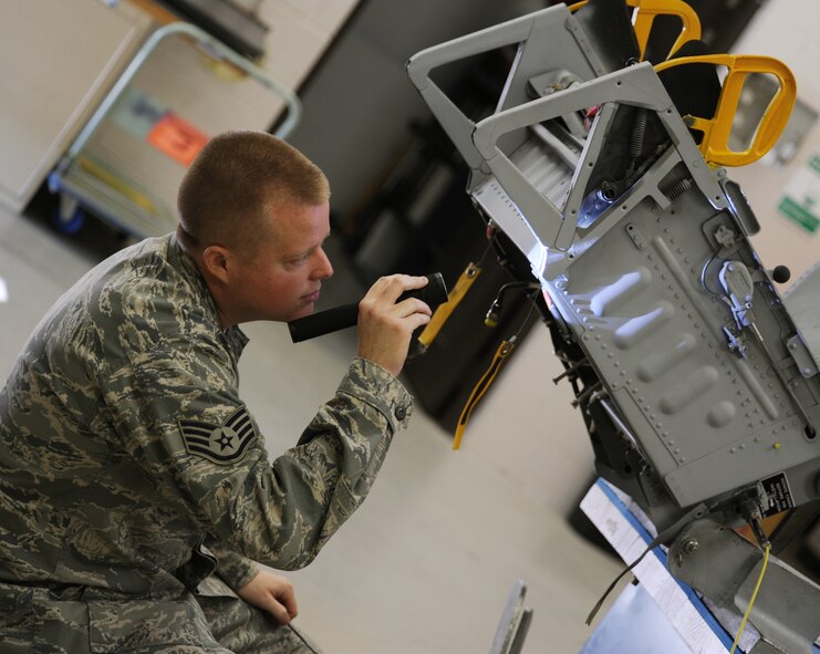 MOODY AIR FORCE BASE, Ga. -- Staff Sgt. Bryan Flaherty, 476th Fighter Group Air Reserve technician, checks an ejection seat for any flaws or missing parts during a routine check here Feb. 3. The 23rd Component Maintenance Squadron was able to create a new process to help shorten the inspection process from 72 hours to 48 hours by using techniques and applications from the Air Force Smart Operations for the 21st Century initiative. (U.S. Air Force photo by Airman 1st Class Benjamin Wiseman)
